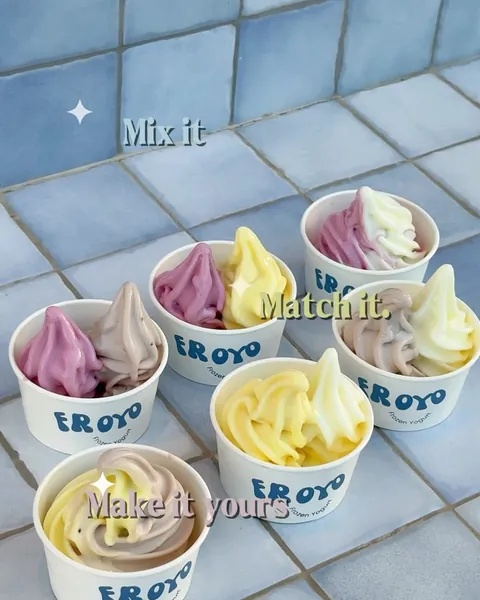 Six cups of mixed pastel frozen yogurt on a tiled table: Mix it, match it, make it yours